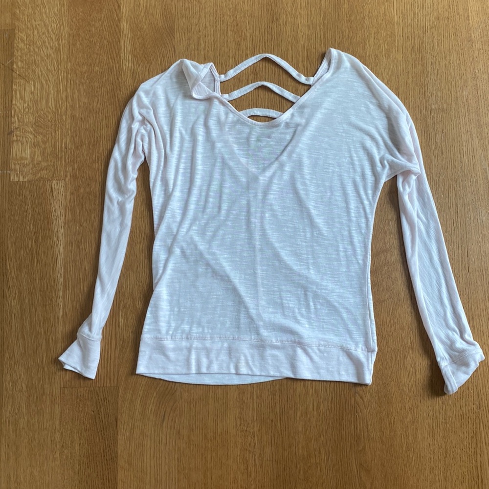 Pink yoga shirt with open back detailing